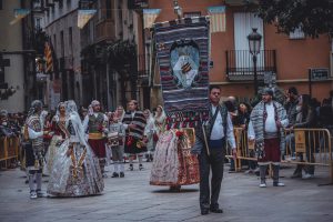 Traditional clothing parade in Valencia, Spain, showcasing vibrant costumes and cultural heritage.